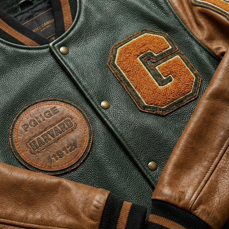 “Heritage Drive” – Varsity jacket in pelle e tessuto con patch iconici