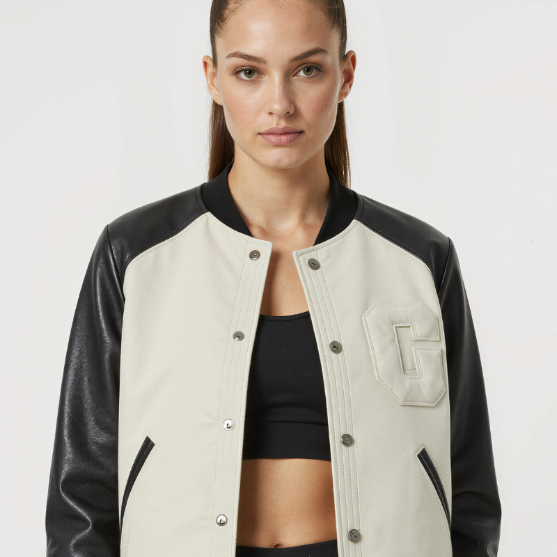 “Letterform Ivory” – Varsity in pelle con corpo crema e dettagli bold